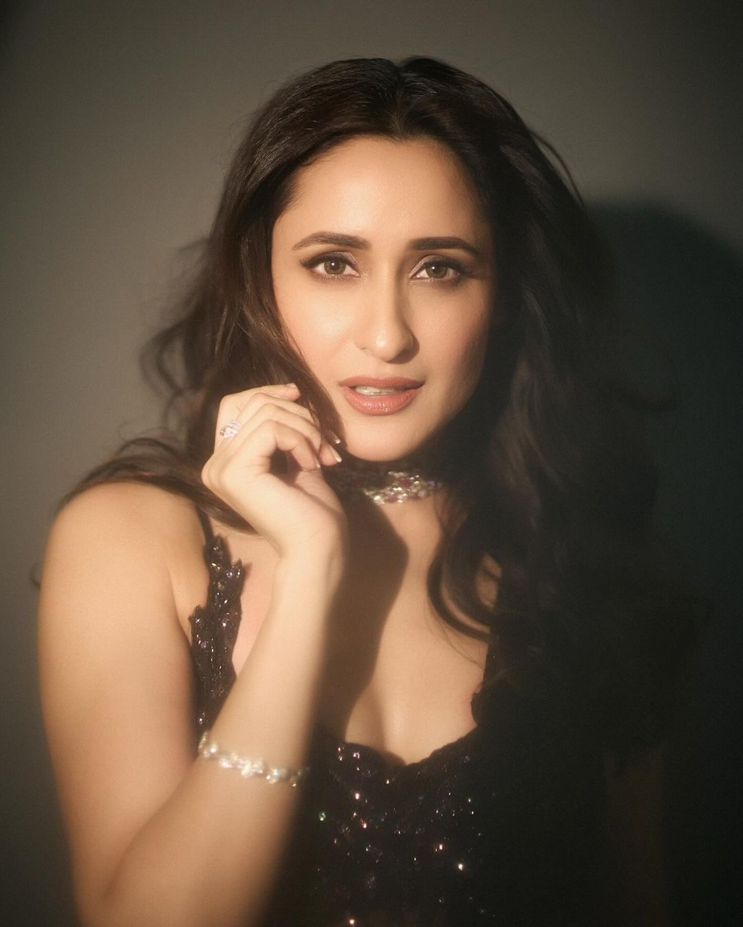 Pragya Jaiswal dazzles in a stunning black sequined saree, exuding elegance and charm