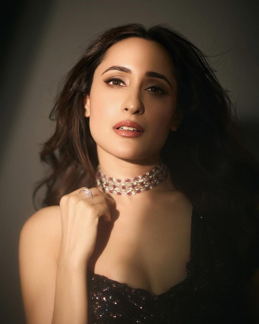 Glamour and grace: Pragya Jaiswal stuns in a sparkling black sequined saree