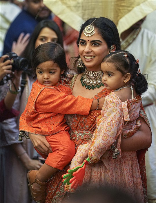 Isha Ambani with her children during a pre-wedding ceremony ahead of the wedding of Anant Ambani and Radhika Merchant, at Antilia.