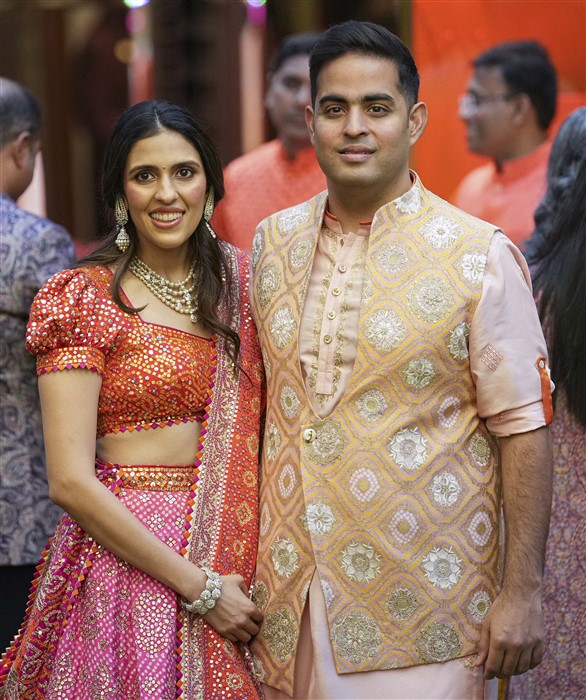 Chairman of Reliance Jio Infocomm Limited (RJIL) Akash Ambani with wife Shloka Mehta Ambani during a pre-wedding ceremony
