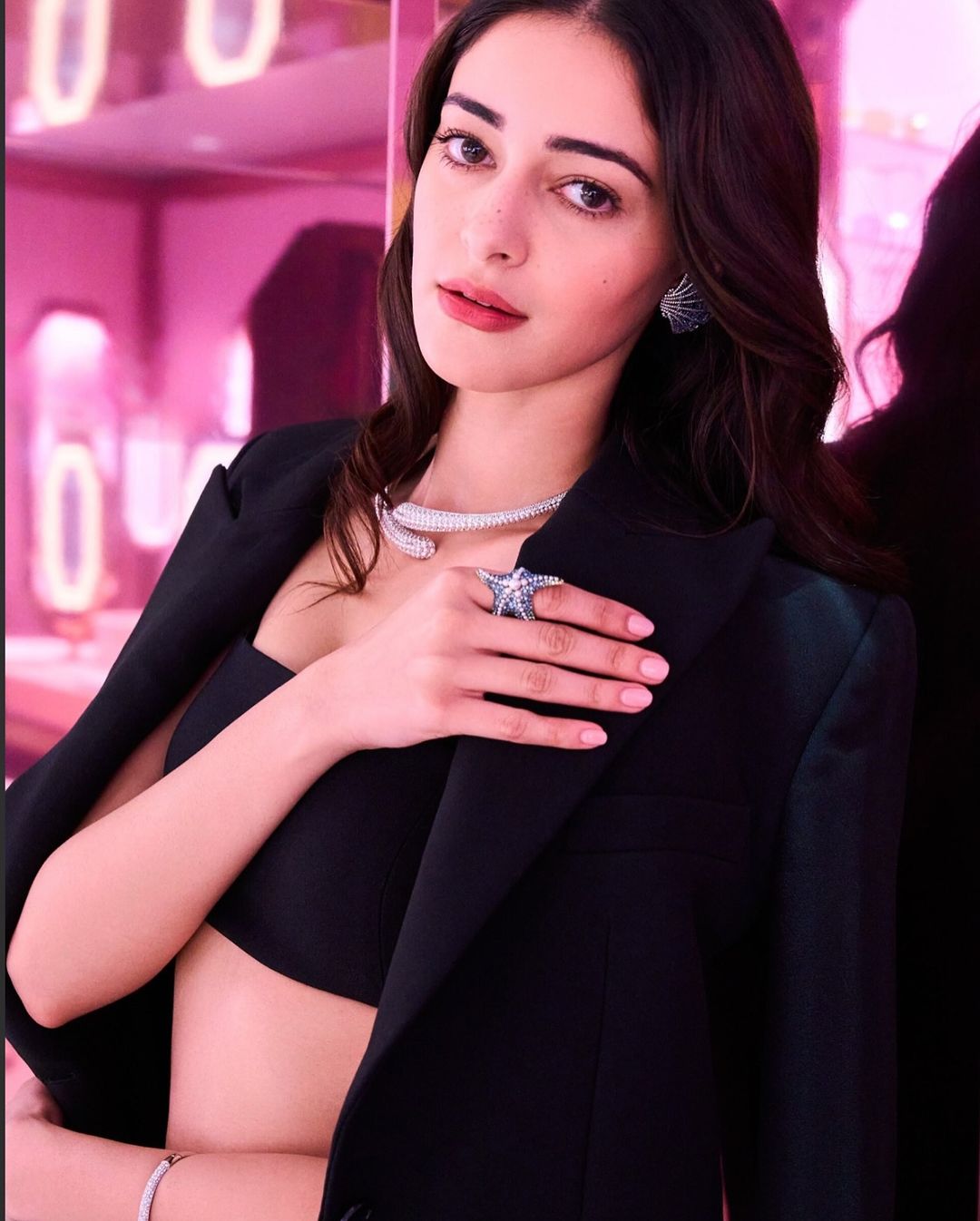 In a unique twist, Ananya Panday rocks a blazer draped over her shoulders, exuding confidence and style