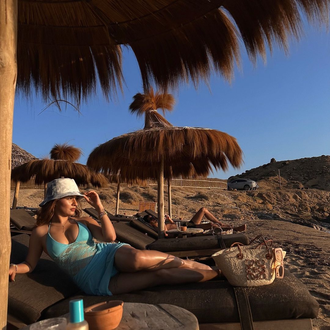 Avneet Kaur stuns in a blue net dress with a plunging neckline, exuding elegance and allure.