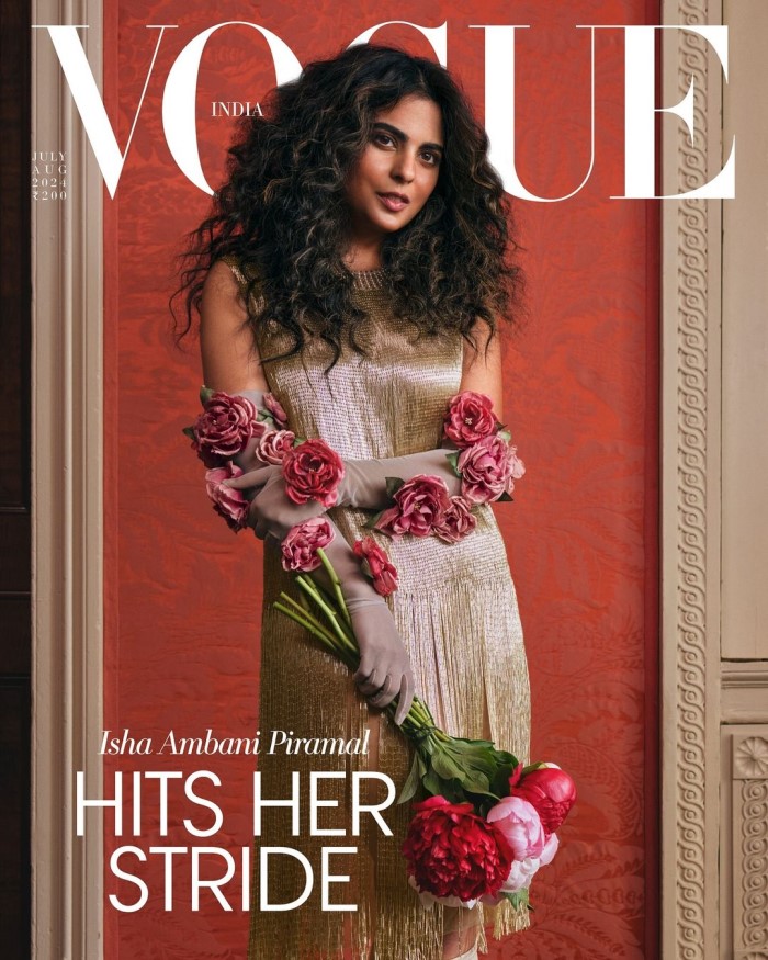 The latest Vogue issue features Isha in a glamorous avatar, dressed in a glitzy dress with floral-adorned gloves and cascading curls.