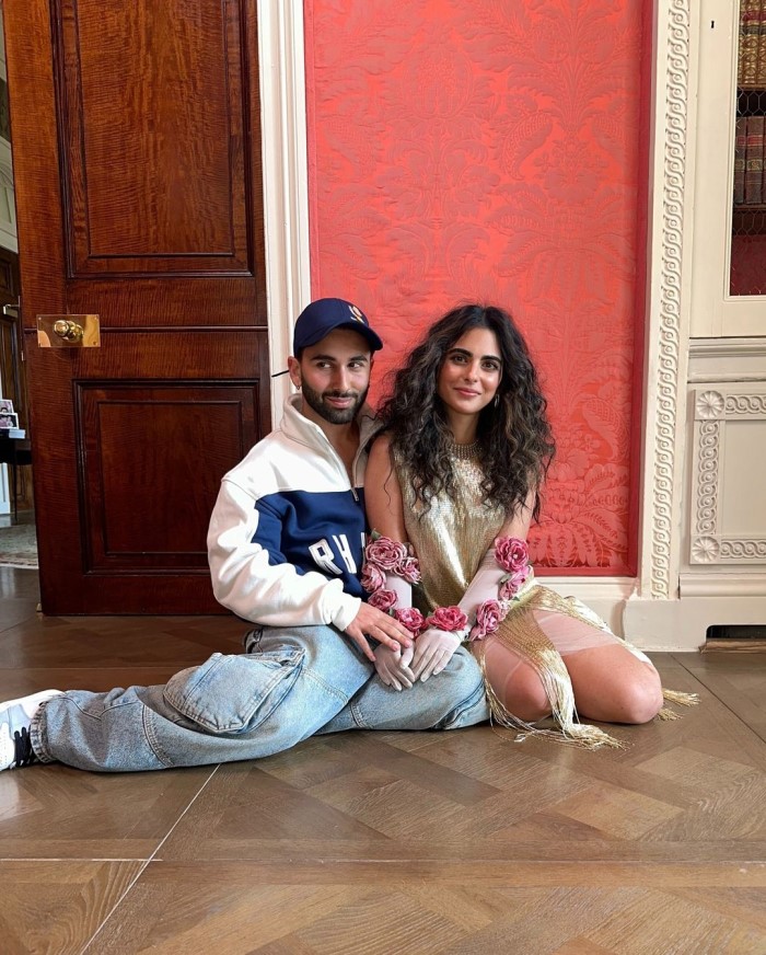 Orry also shared another picture on Instagram where he is sitting on the floor with Isha, posing for a photo.