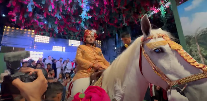 Groom Anant Ambani on a horse during his baraat procession.
