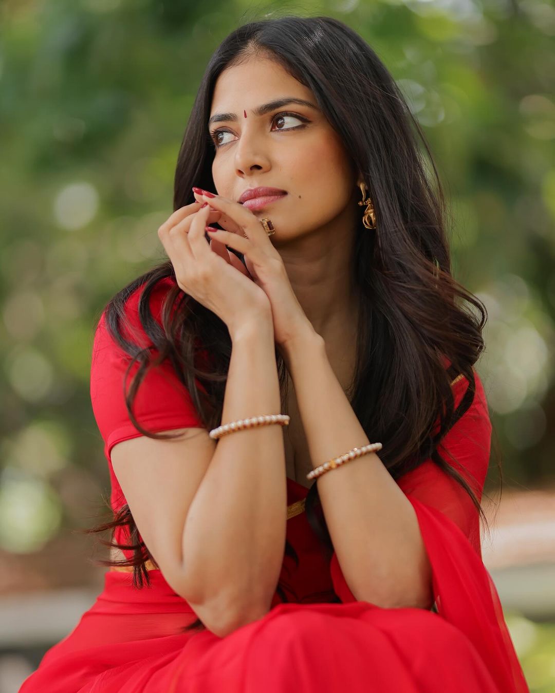 Malavika Mohanan dazzles in a red saree, exuding elegance and charm