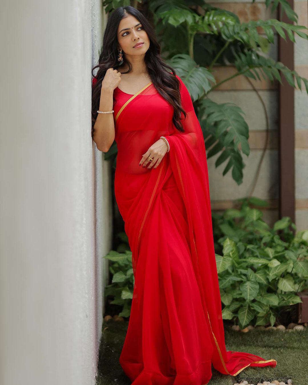 Malavika Mohanan captivates in a stunning red saree