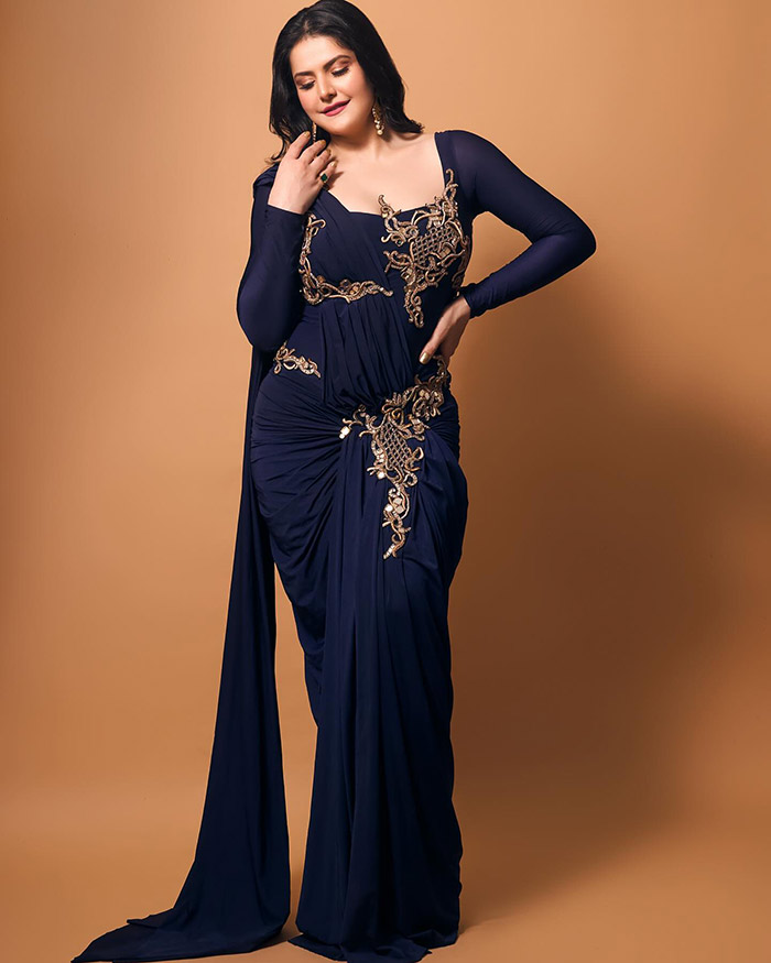 Zareen stuns in a modern adaption of a pre-draped saree, which looks like a gown.
