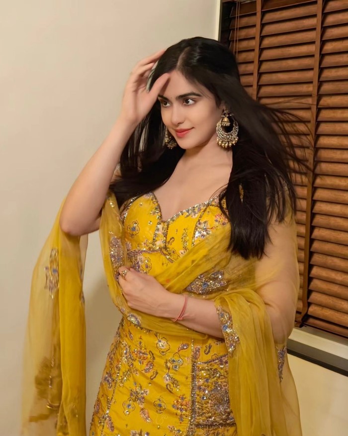 Adah humorously captioned the photo, wondering how wind entered a closed room and suggested a helicopter as the explanation.