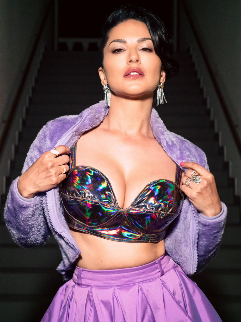 Sunny rocks a low-neck bralette jacket and matching skirt, turning heads everywhere