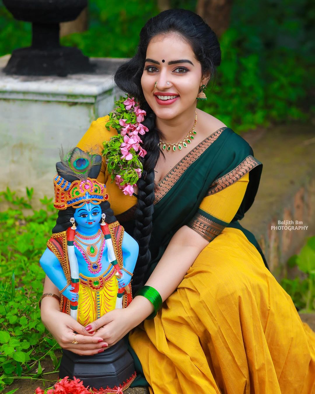Malavika wore a traditional davani (half saree) in vibrant colors