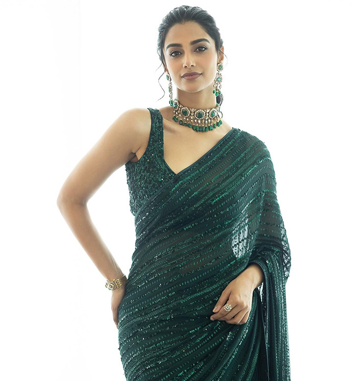 Meenakshi Chaudhary portrays Srinidhi, adding charm and strength to her character. Her role is integral to the film’s emotional core.