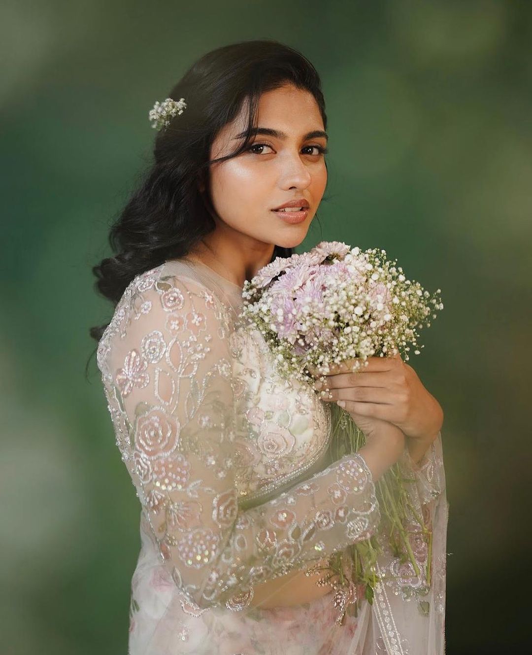 Mamitha Baiju recently stunned everyone in a dreamy white organza saree.