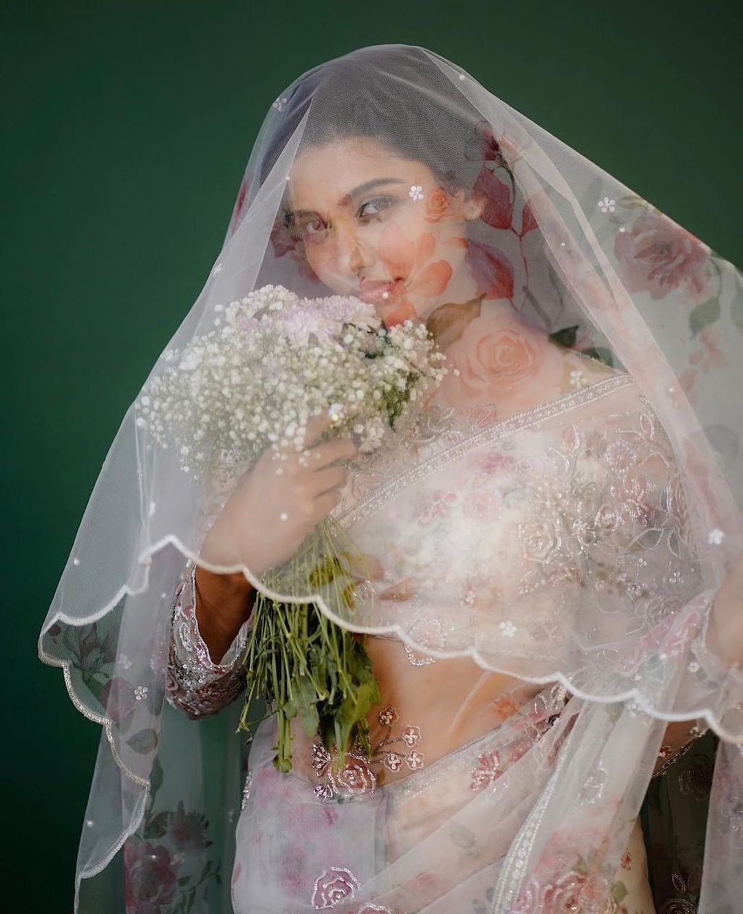 Mamitha Baiju recently stunned everyone in a dreamy white organza saree.