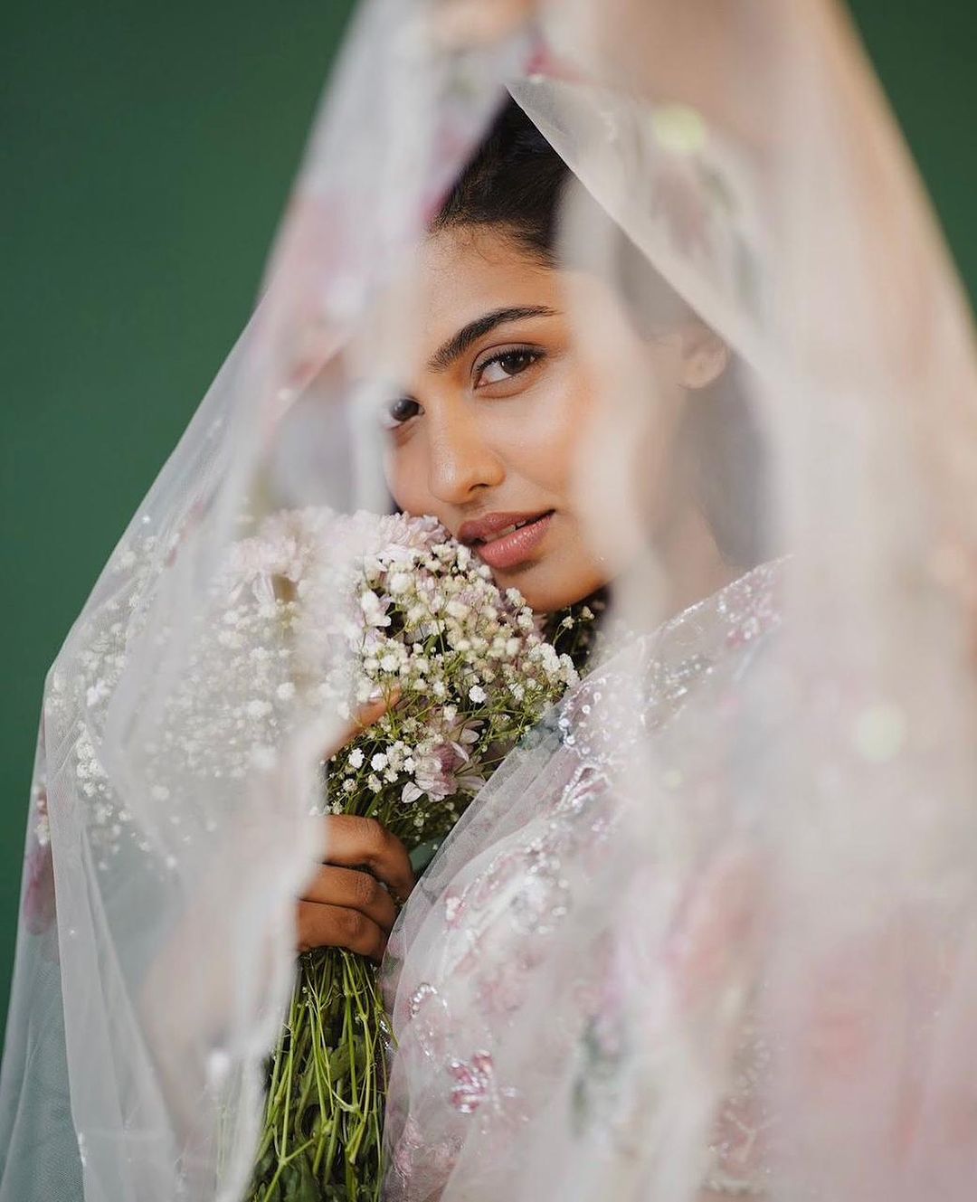 Mamitha Baiju recently stunned everyone in a dreamy white organza saree.
