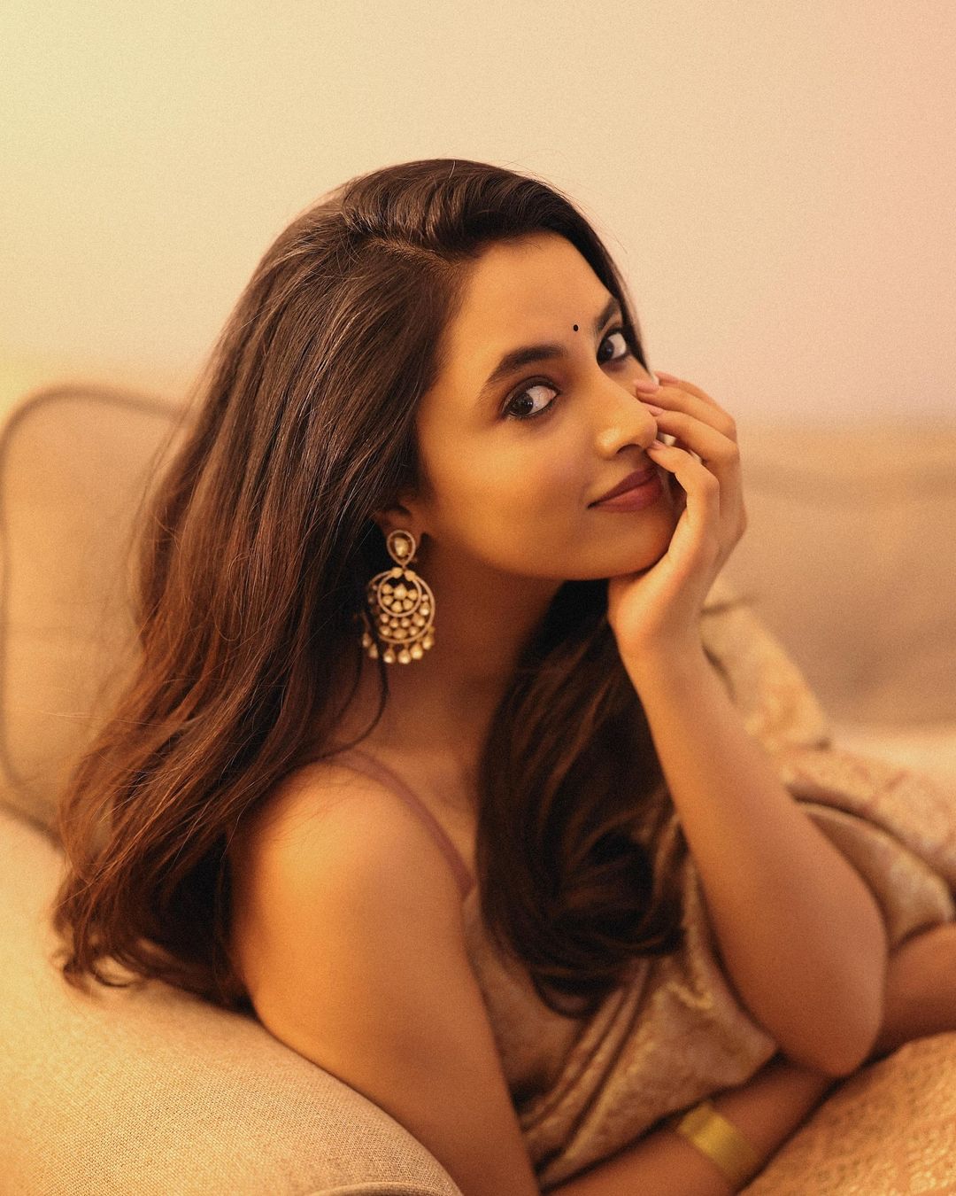 Priyanka Mohan is draped in a stunning beige silk saree