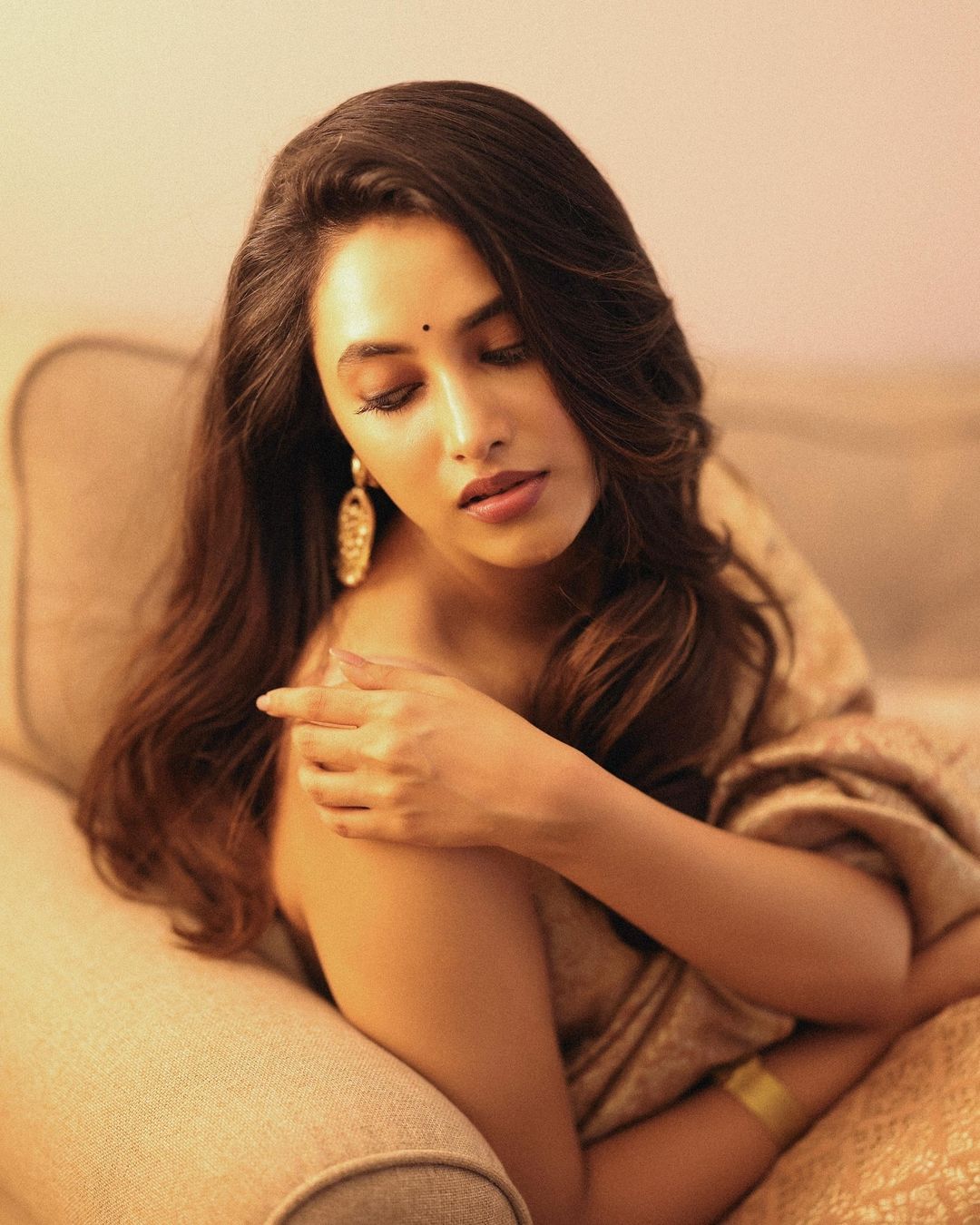 Priyanka Mohan is draped in a stunning beige silk saree