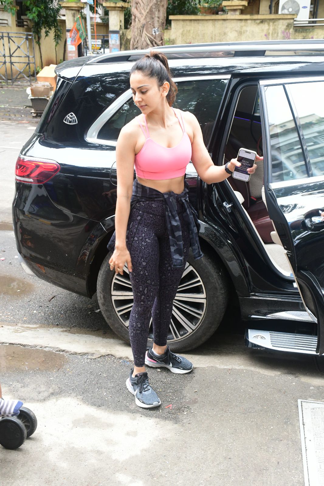 Rakul Preet was dressed in a pink sports bra and black yoga pants spotted outside Gym.