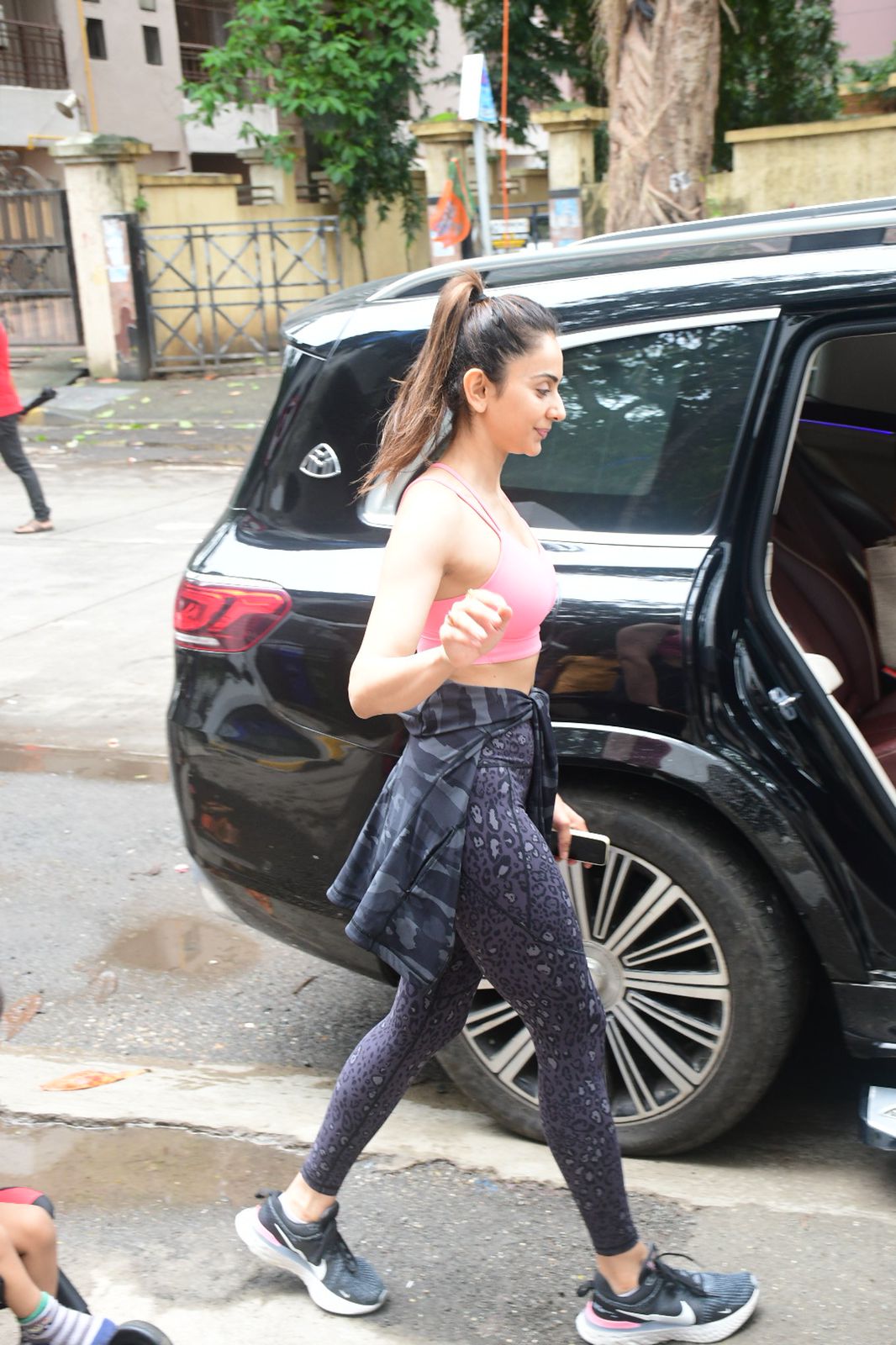 Rakul Preet was dressed in a pink sports bra and black yoga pants spotted outside Gym.