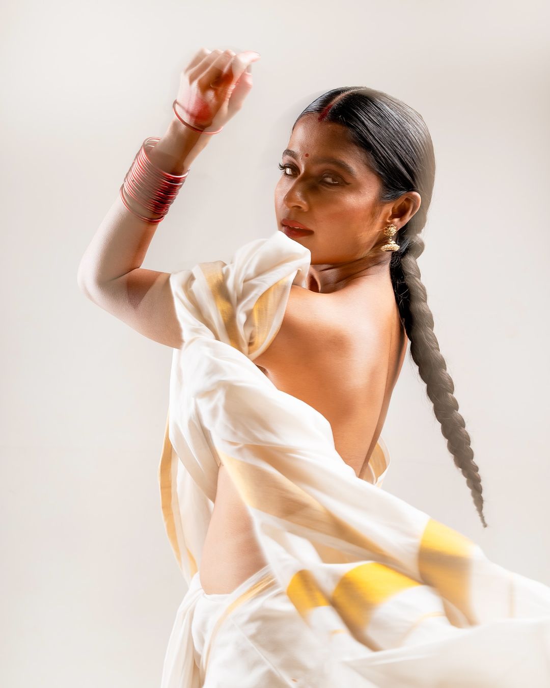 Chaithra J Achar looks stunning in a traditional white Kerala saree