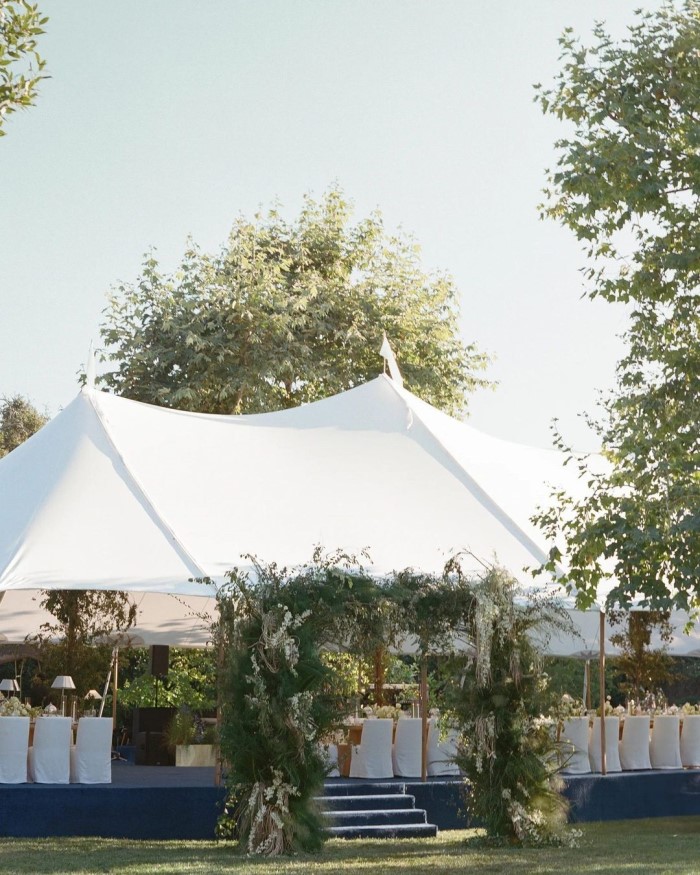 The reception included cocktails on the pool patio and a tented dinner.