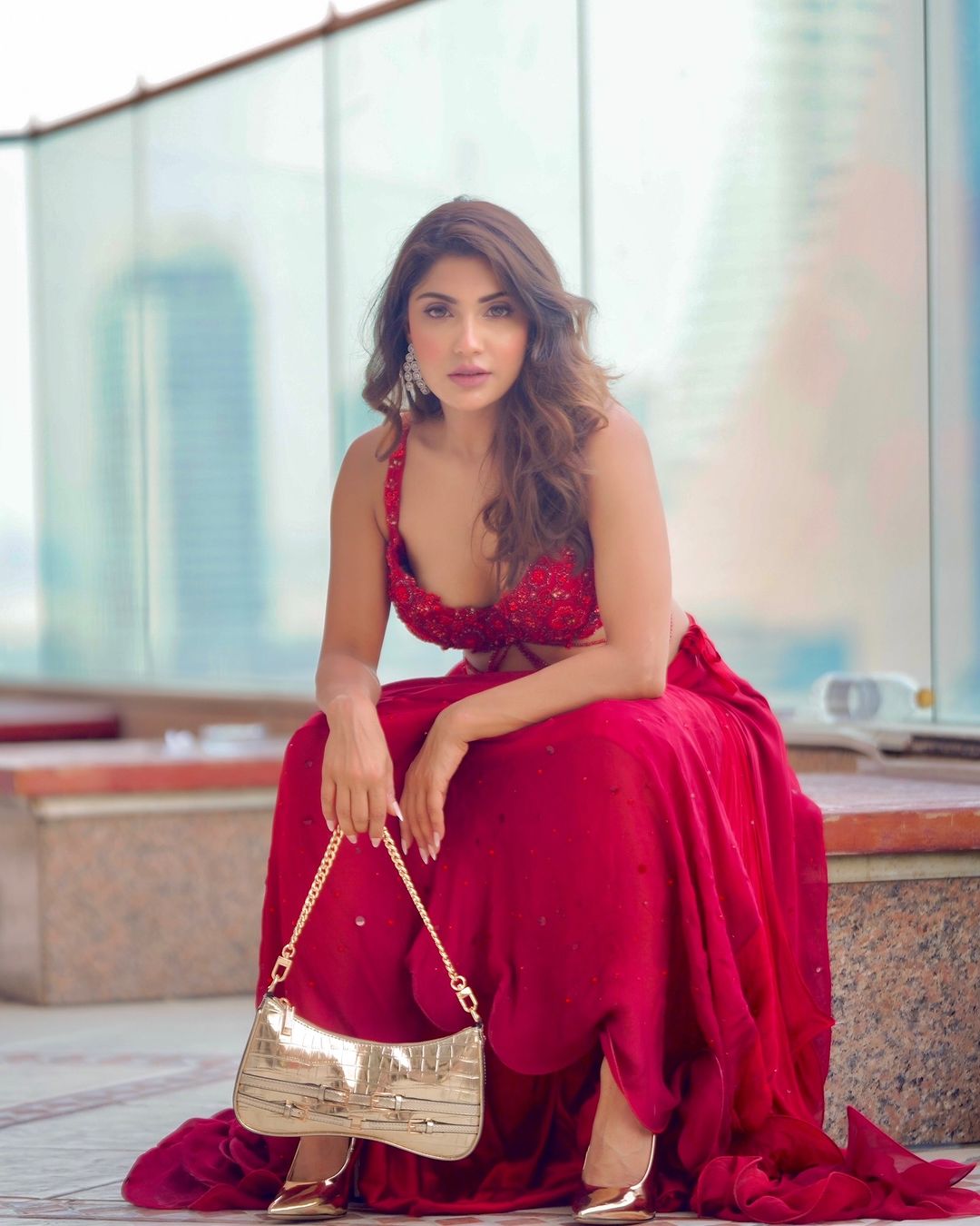 Ishita Raj Sharma is seen radiating elegance in a vibrant red dress.