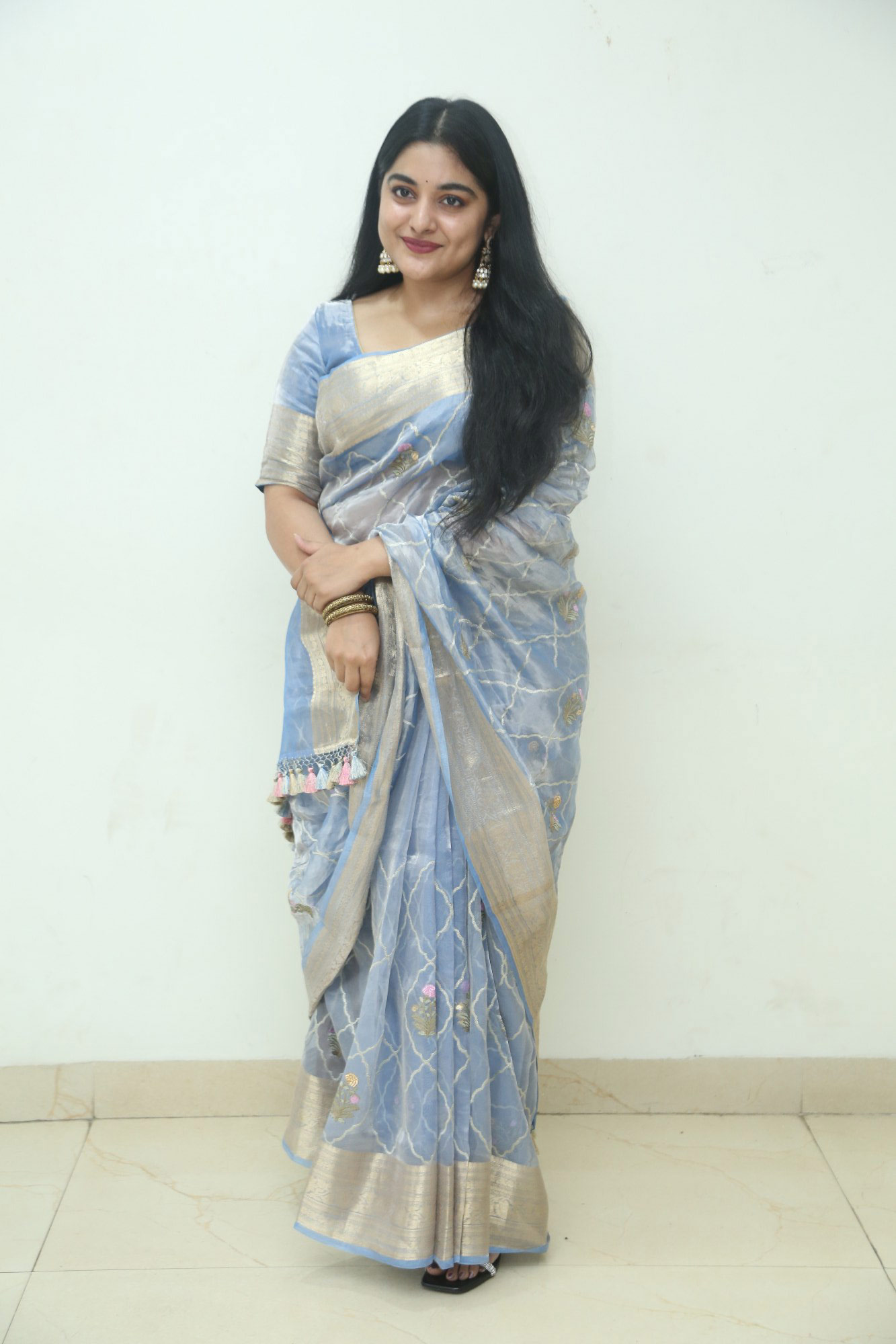 Nivetha Thomas chose a striking blue saree
