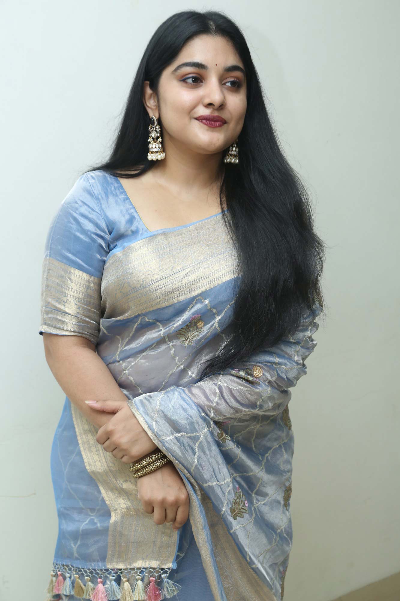 Nivetha Thomas chose a striking blue saree