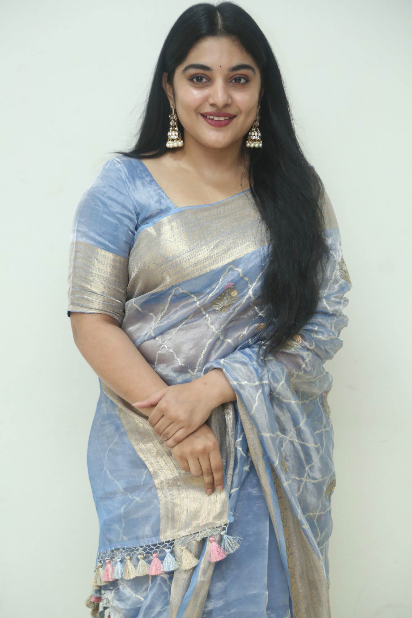 Nivetha Thomas chose a striking blue saree