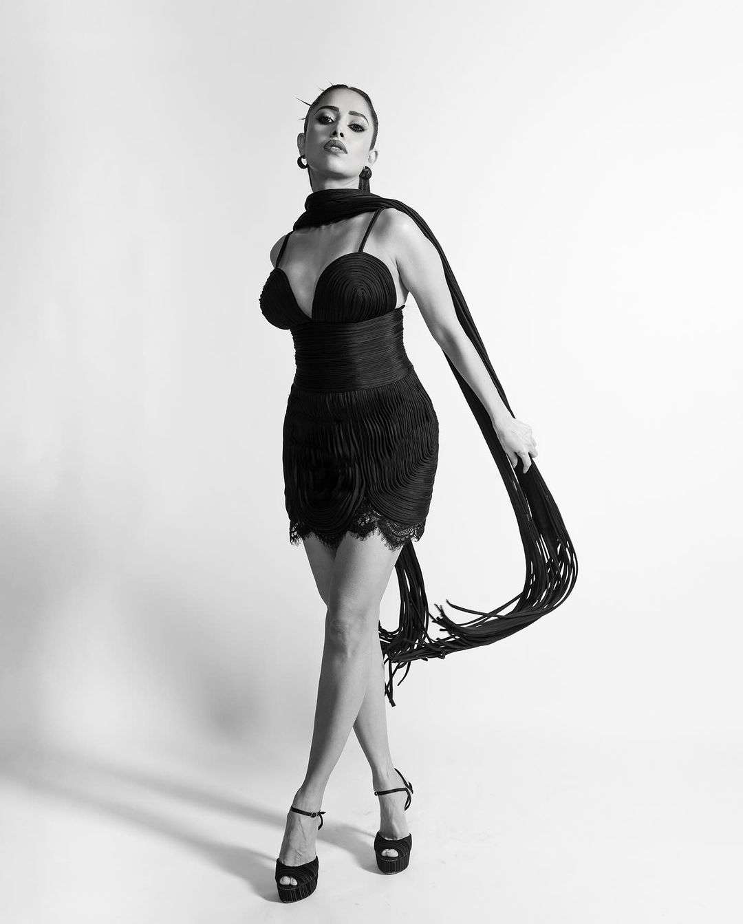 Nushrratt is seen wearing a sleek black dress and Her Monochromatic Photos Make Waves