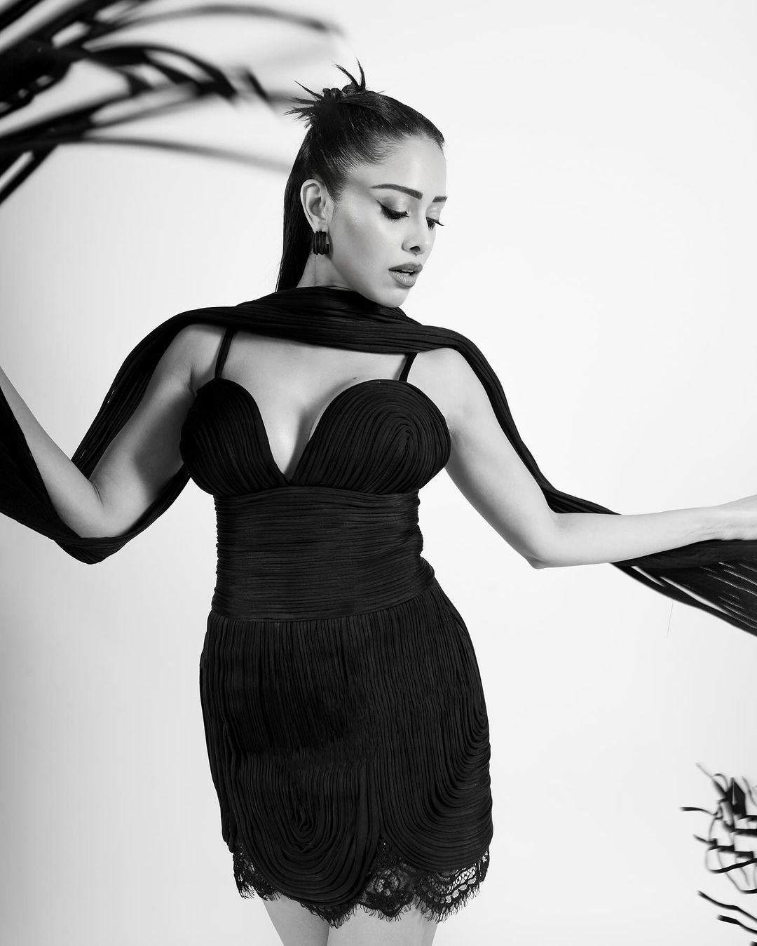 Nushrratt is seen wearing a sleek black dress and Her Monochromatic Photos Make Waves
