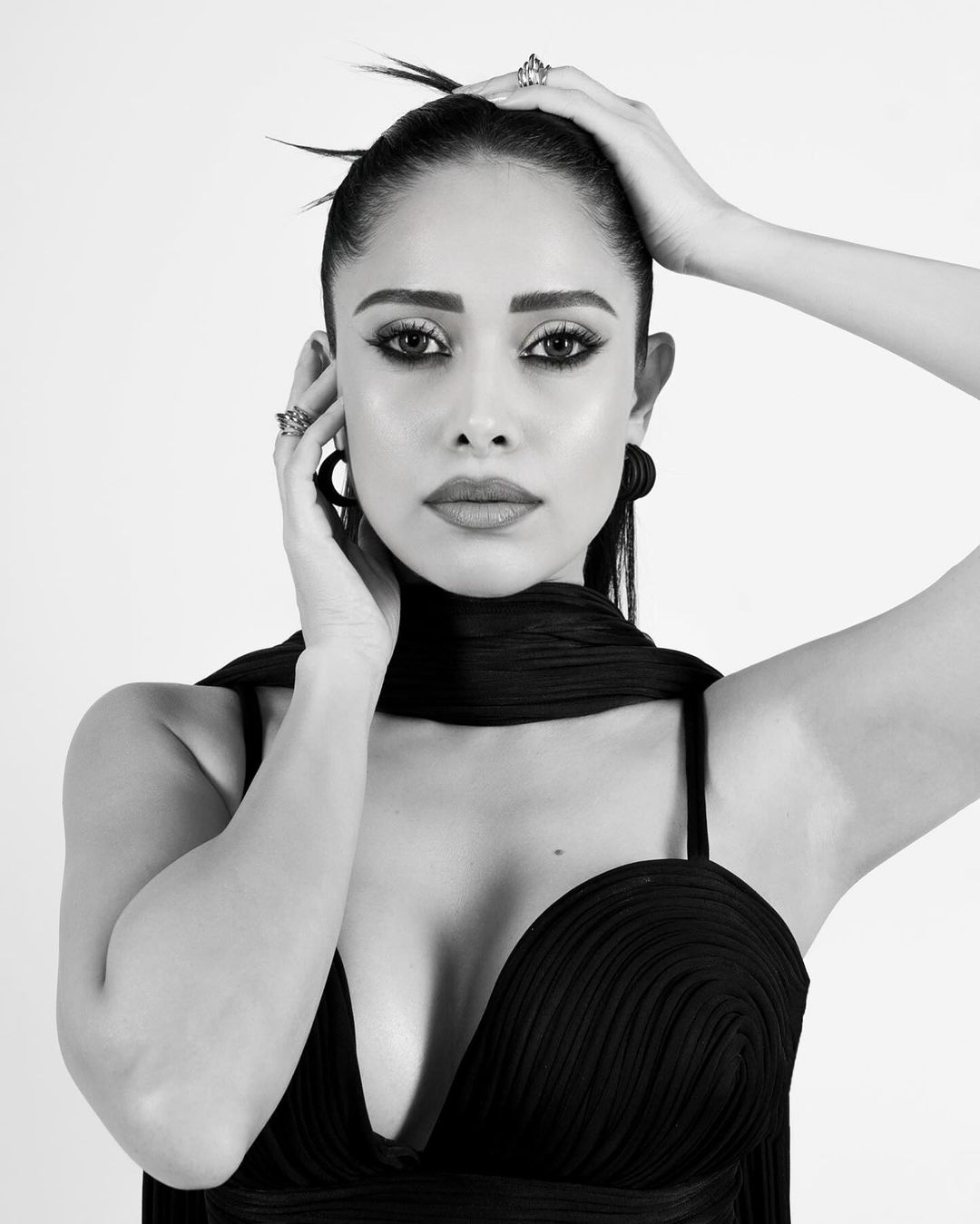 Nushrratt is seen wearing a sleek black dress and Her Monochromatic Photos Make Waves
