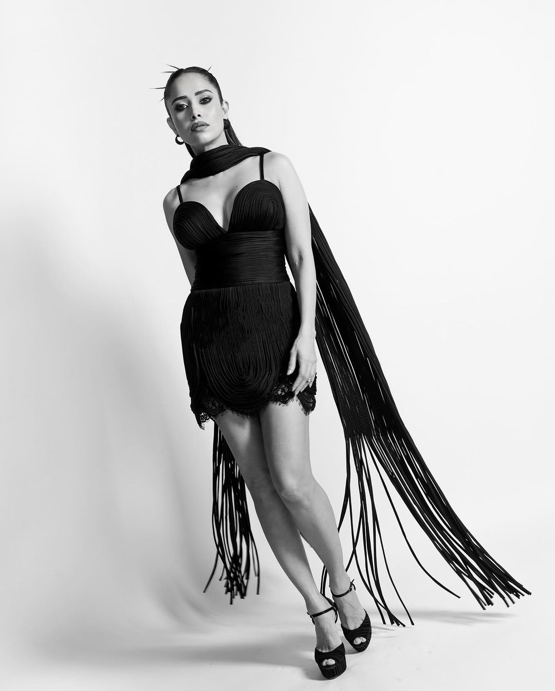 Nushrratt is seen wearing a sleek black dress and Her Monochromatic Photos Make Waves