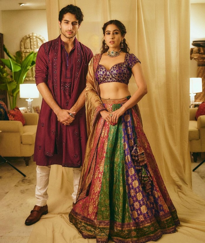 The lehenga skirt was made from brocade sarees in purple, green, and pink hues.