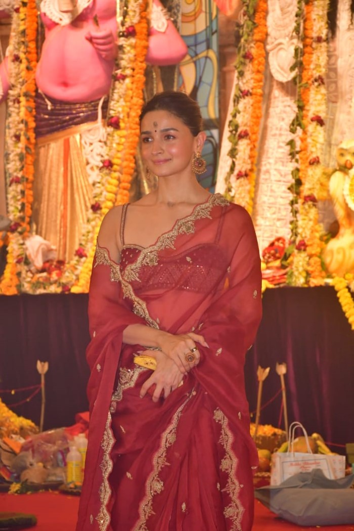 She looked stunning in a red saree, paired with minimal accessories and a bun hairstyle.