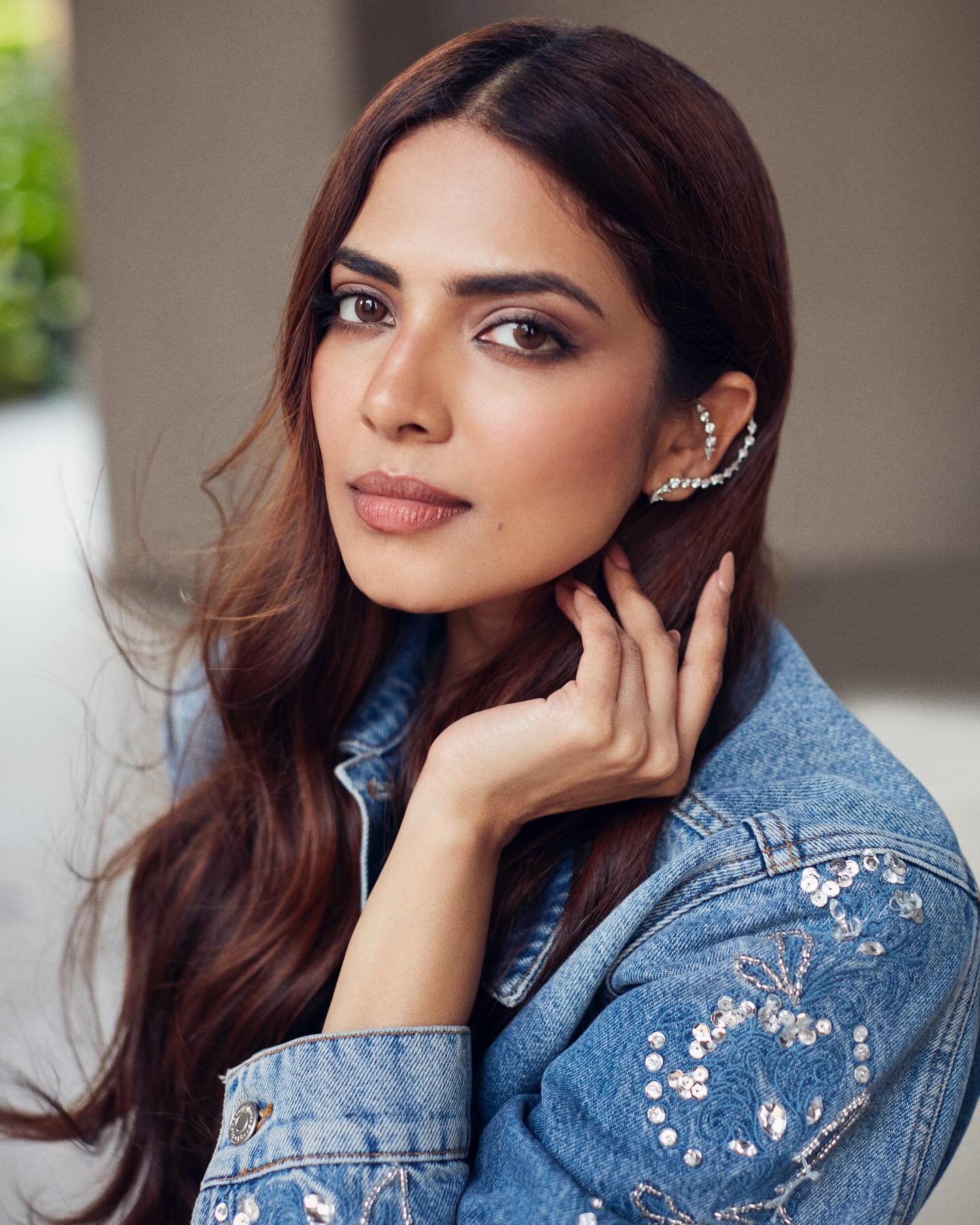 Malavika Mohanan stuns in a cropped denim jacket paired with a black, fitted mini-skirt