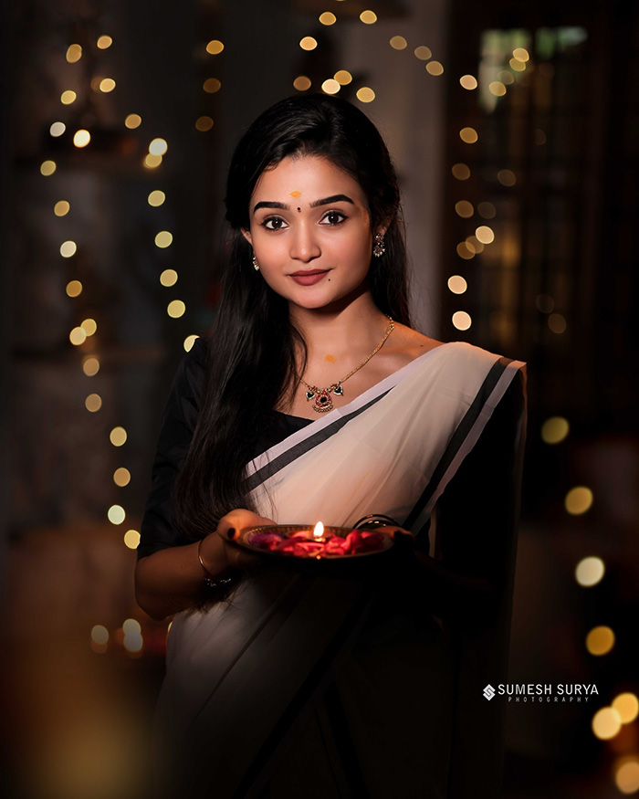 Dressed in a beautifully adorned sari, Meenakshi showcases the elegance of traditional Indian fashion, blending cultural richness with modern style.