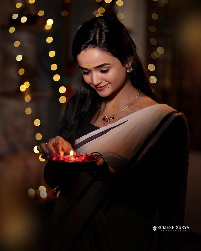 The photoshoot highlights joyful moments as Meenakshi lights the diva, spreading warmth and positivity. The stunning visuals reflect the festive joy and celebration.