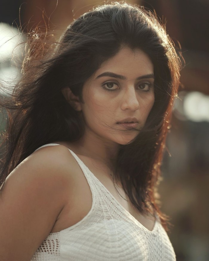 Kannada Actress Megha Shetty keeps the look simple without any visible accessories, letting the dress and her natural beauty take center stage.