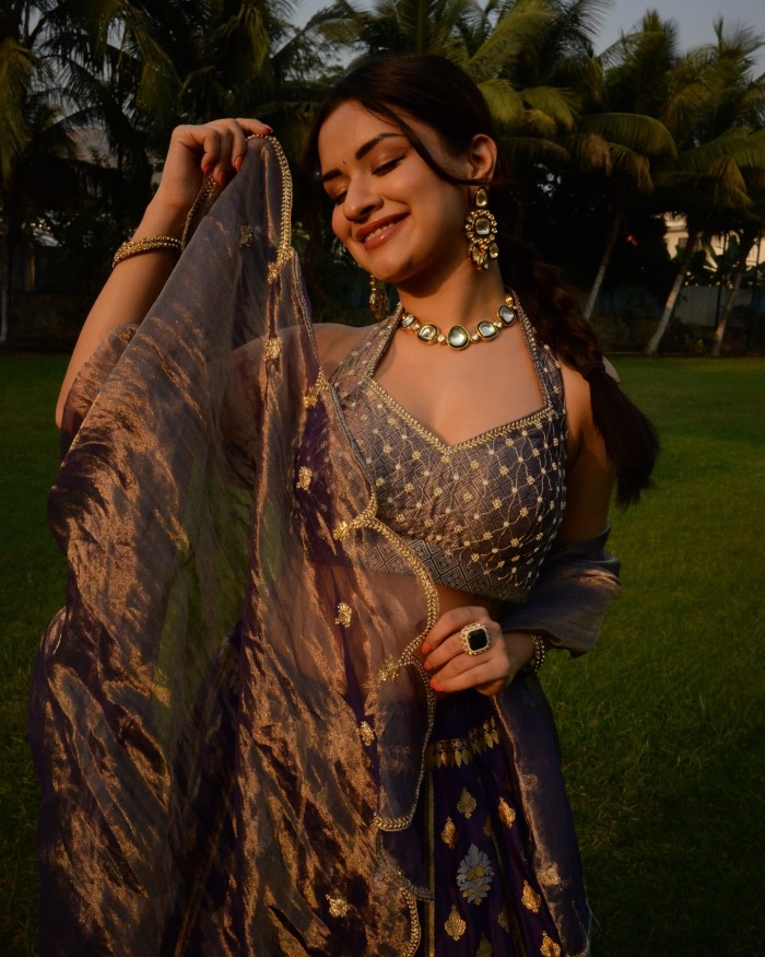 Avneet Kaur dazzles in a beautifully crafted purple and gold designer lehenga, showcasing her impeccable style and love for traditional Indian attire.