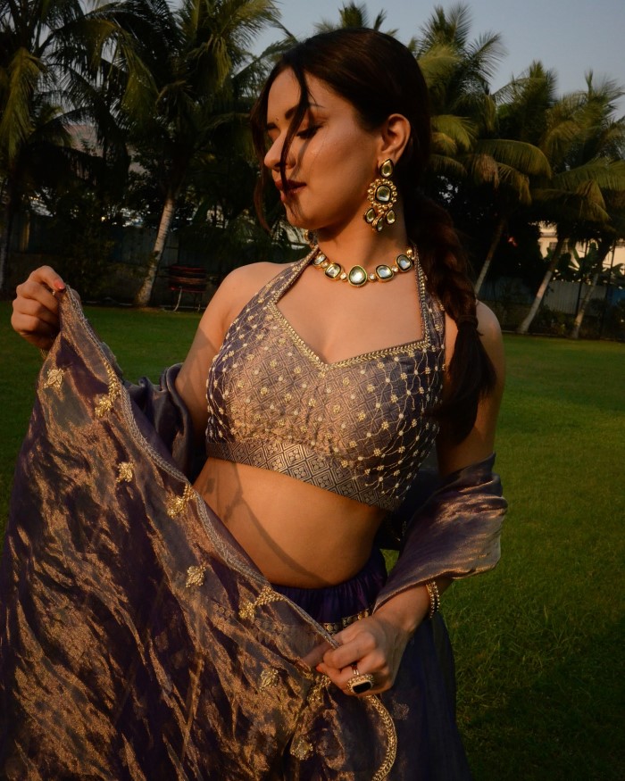 Avneet completes her ensemble with elegant jewelry, including a necklace, earrings, and bangles, enhancing the overall charm and sophistication.