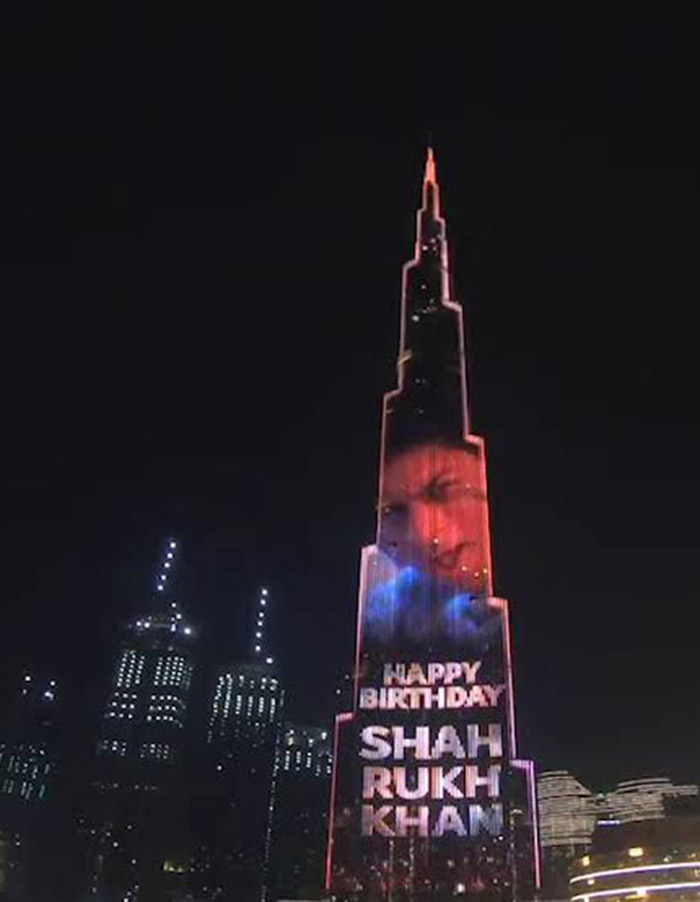 Fans gathered around the Burj Khalifa, capturing the spectacular moment on their phones, celebrating Shah Rukh Khan's milestone with joy and admiration.