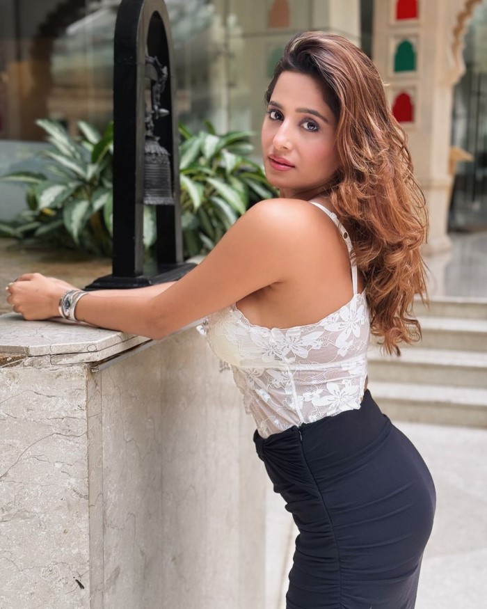 Kate Sharma looked absolutely stunning in a white lace top paired with a black slit skirt. The delicate lace contrasted beautifully with the bold skirt, creating an elegant yet edgy look that highlighted her impeccable fashion sense and style.