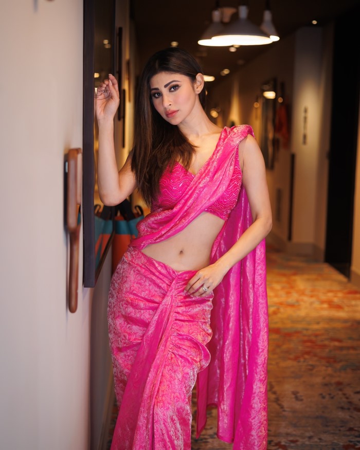 Mouni Roy's pink saree look is a timeless example of how traditional attire can be both glamorous and chic.