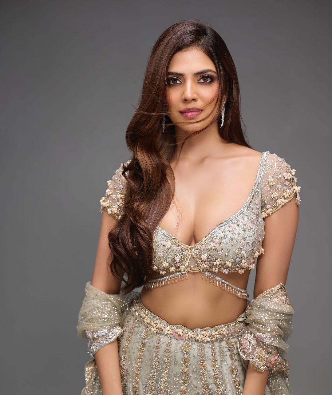 Netizens compare Malavika mohanan with kim kardashian after she wears low neck lehenga