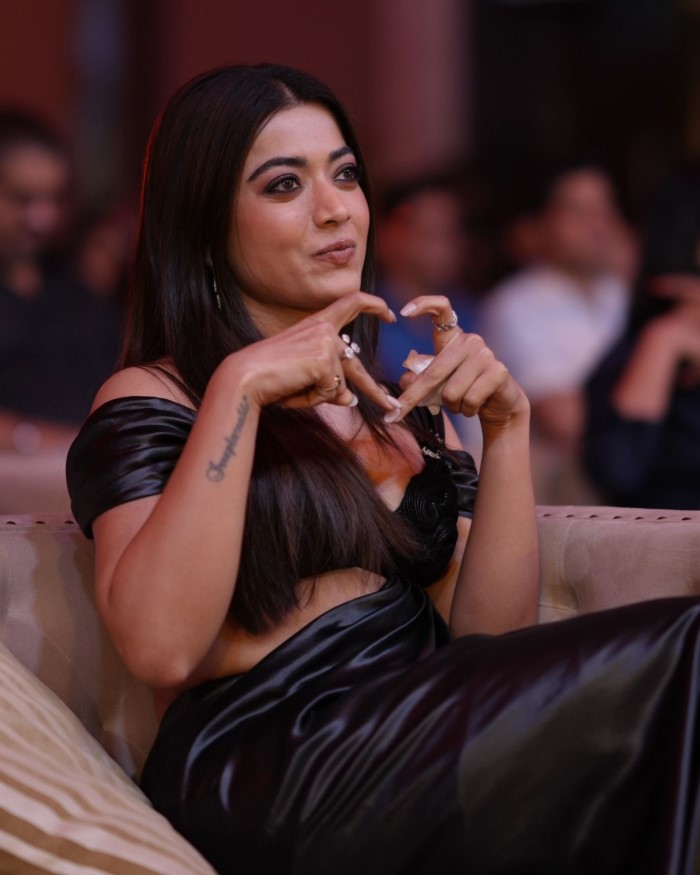 Her hair was styled in her signature mid-parted way, with silky tresses left open, enhancing her overall elegant vibe.
