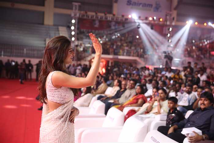 Sreeleela's hair was styled in loose waves, cascading down her shoulders. The effortless yet polished hairstyle added to her charm and complemented her traditional attire.