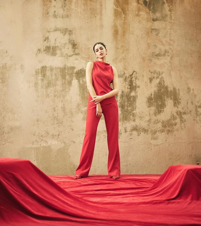 Ananya's choice of a bold red outfit exuded confidence and elegance, capturing the essence of her vibrant personality.