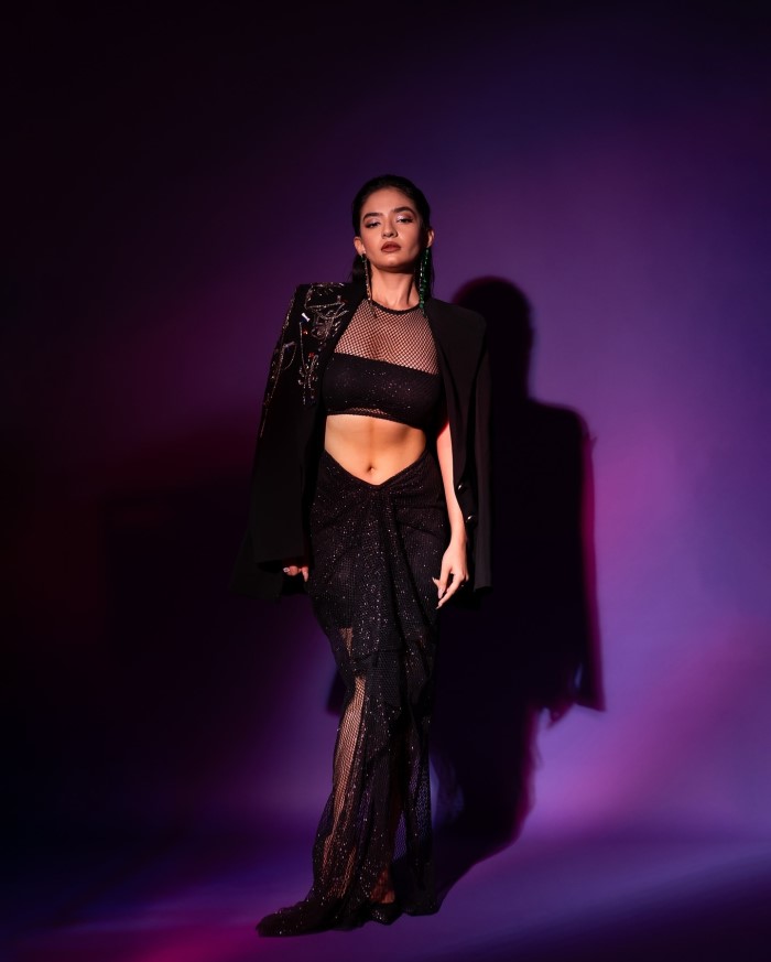 Anushka Sen dazzles at the GQ event, wearing a black mesh skirt and top paired with a black shimmery jacket.