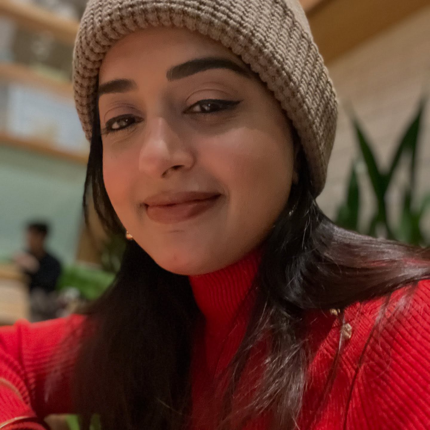 Meera Jasmine was spotted enjoying the holiday season in a vibrant red outfit